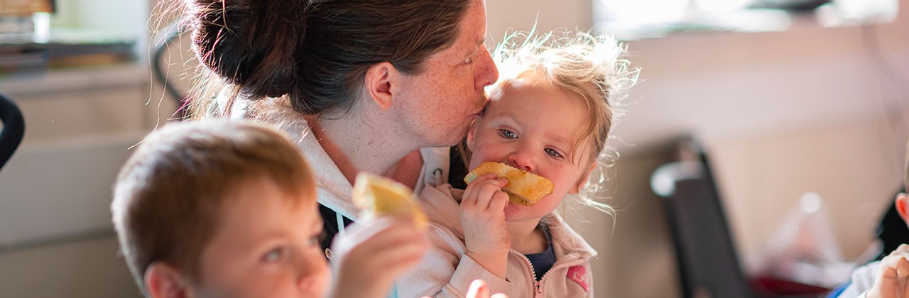 A family enjoying food provided by the charity FareShare who have had to double the amount of food they provide since the pandemic started