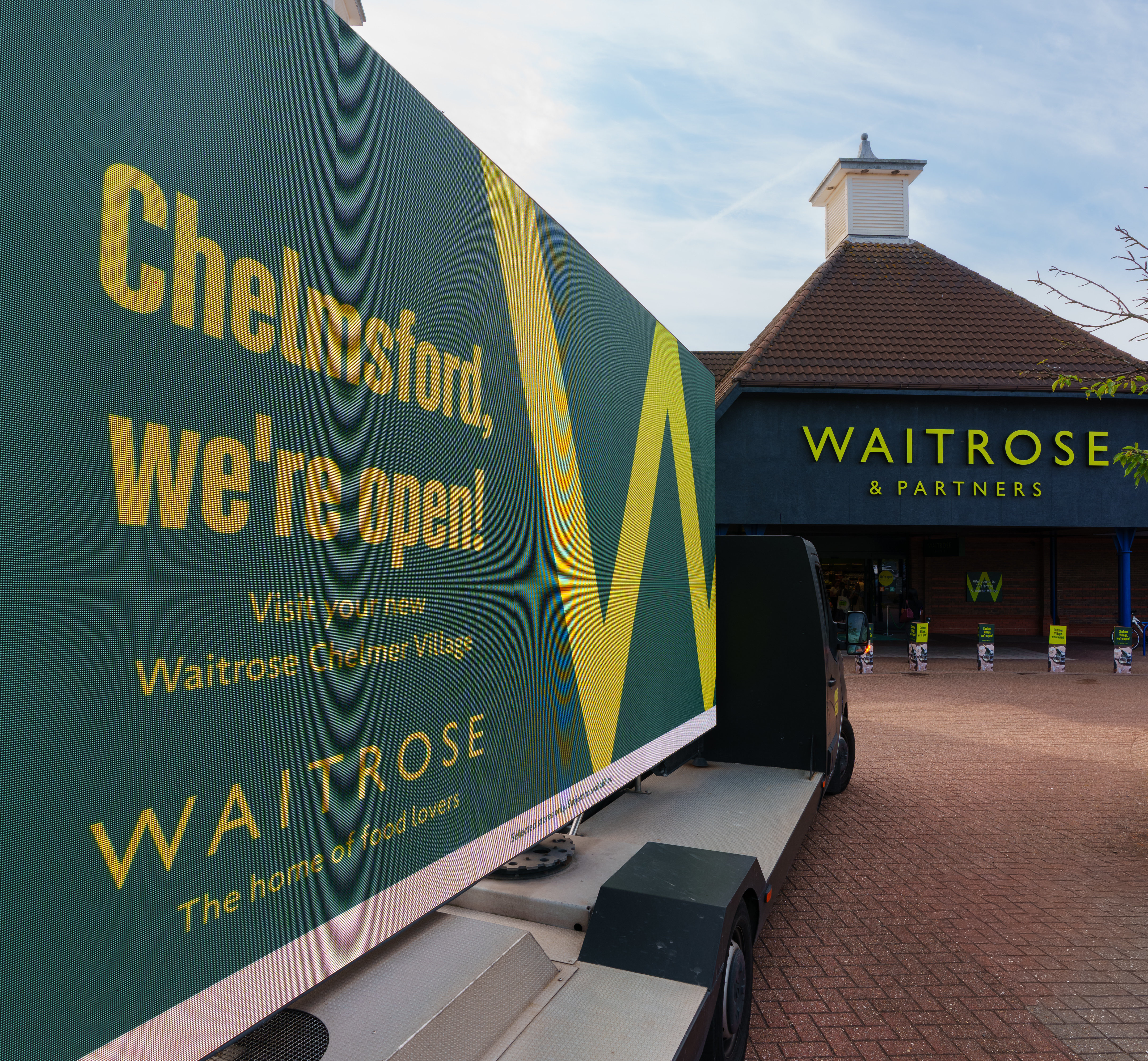 Chelmsford, we're open! poster outside a Waitrose store