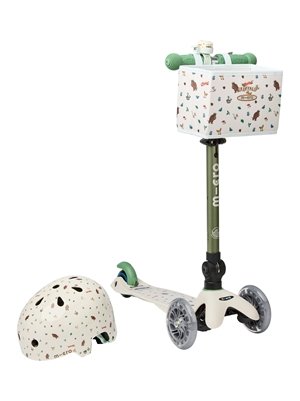 Green and off-white three-wheeled Micro Scooter with transparent light-up wheels, a handlebar basket printed with Gruffalo characters, and a matching patterned helmet beside it.