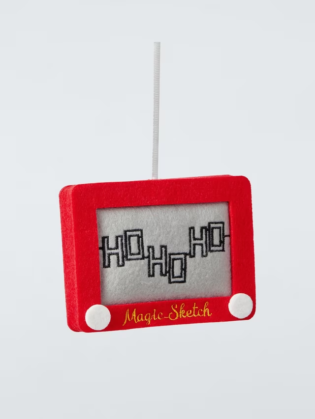 A red felt hanging ornament styled like a retro Etch A Sketch screen, featuring black stitched text that reads